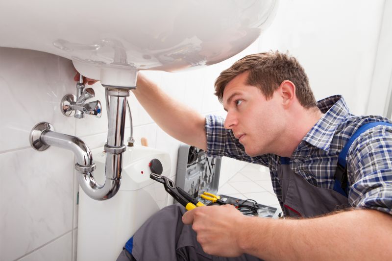 Plumber Installing Fixture